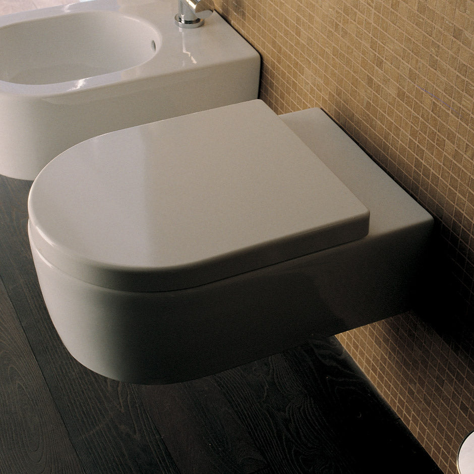 Lacava 5051WC-001 - Wall-Hung Porcelain Toilet For Concealed Flushing System ( Geberit #Ge 111335005). Includes A Soft-Closing Seat Cover. W: 14 1/8", D: 22", H: 12 3/8".