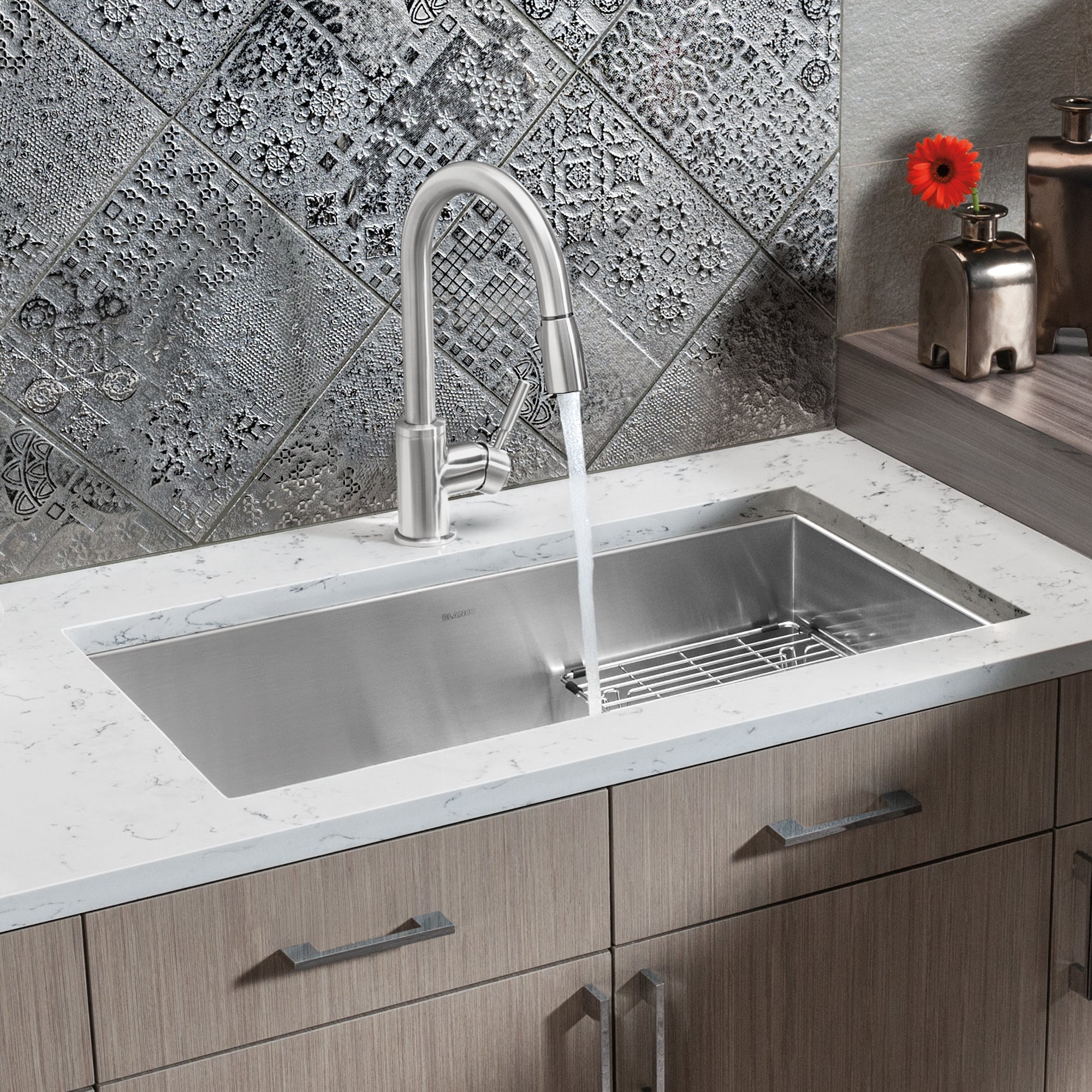 sui① Zucchetti - ZXS single lever sink mixer with swivel spout.